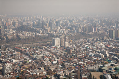 High angle view of buildings in city against sky