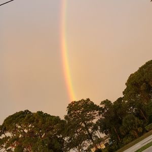 Low angle view of rainbow against sky