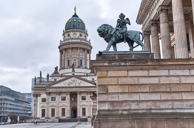Low angle view of statue of building against sky