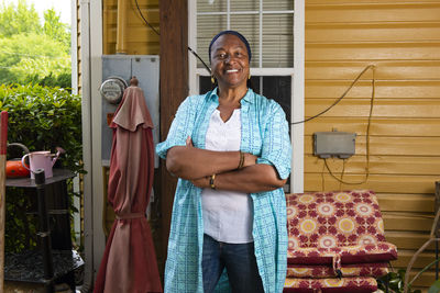 Portrait of a smiling african-american woman standing arms crossed