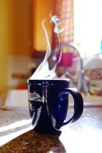 Close-up of coffee cup on table