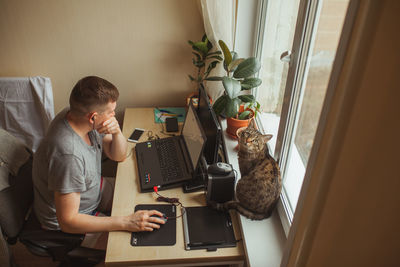 High angle view man working at home