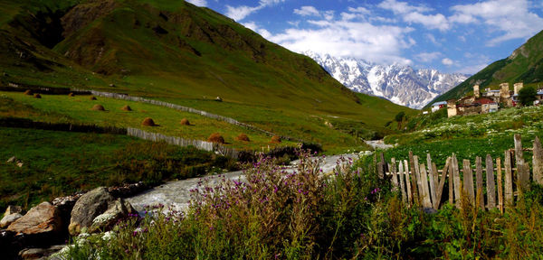 Scenic view of landscape and mountains against sky