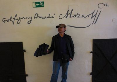 Full length of man standing against wall