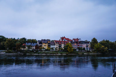 Residential district by lake at dusk