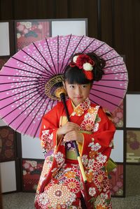 Low angle view of girl in traditional clothing