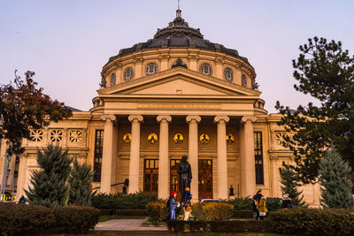 Group of people in front of historical building