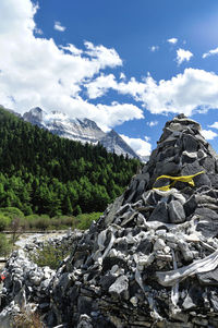 Rock formation on field against mountains