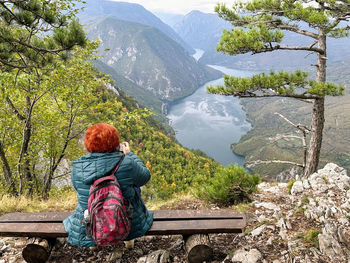 Rear view of woman looking at mountains