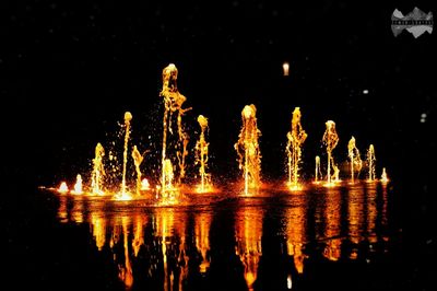 Close-up of illuminated reflection in water