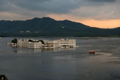 Scenic view of lake against sky during sunset