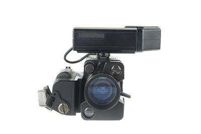 Close-up of camera against white background