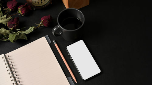 High angle view of coffee cup on table