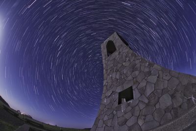 Low angle view of building against sky at night