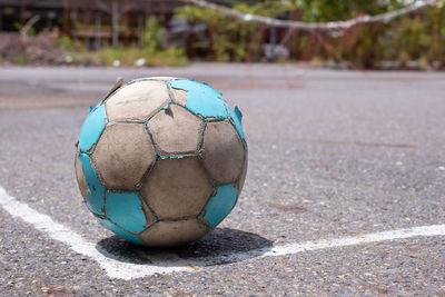 Close-up of soccer ball on field