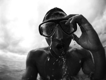 Low angle view of man wearing sunglasses against sky