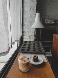 Electric lamp hanging on table at home