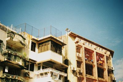 Low angle view of building against blue sky