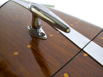 High angle view of electric lamp on wooden table