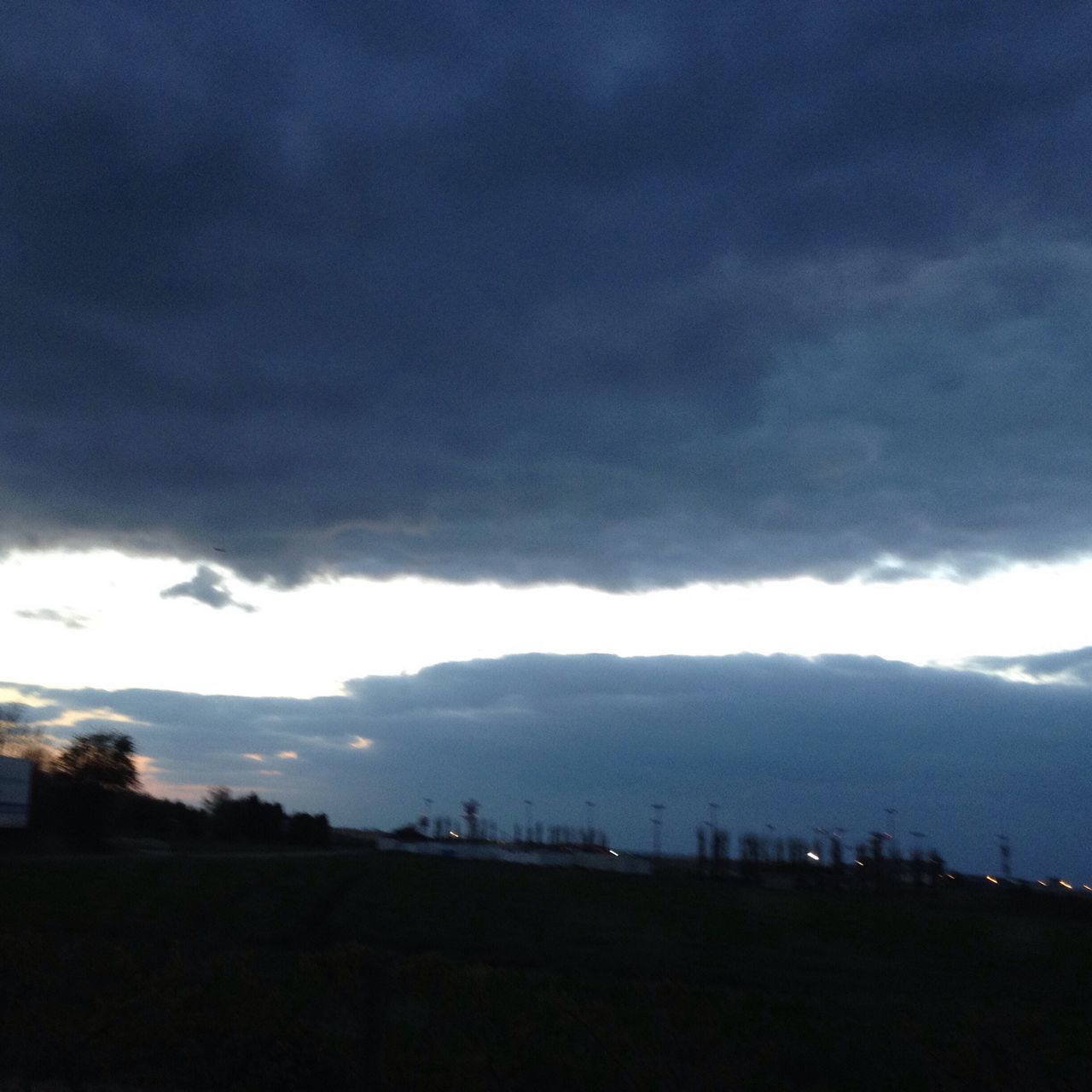 sky, cloud - sky, cloudy, storm cloud, weather, cloud, overcast, landscape, scenics, beauty in nature, silhouette, dramatic sky, nature, dusk, tranquility, cloudscape, tranquil scene, building exterior, built structure, atmospheric mood