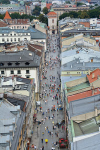 High angle view of people walking on street in city