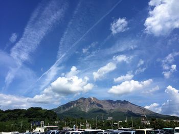 Scenic view of mountains against cloudy sky