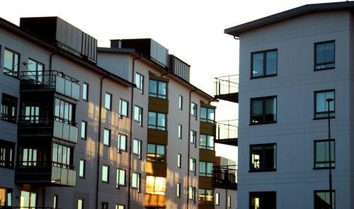 Low angle view of buildings against clear sky