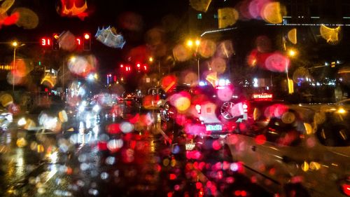 Illuminated city street at night