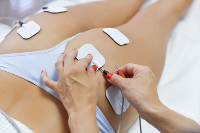 Midsection of woman holding hands