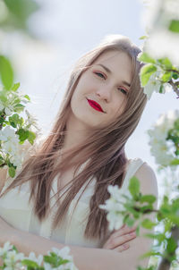 Portrait of a beautiful young woman outdoors