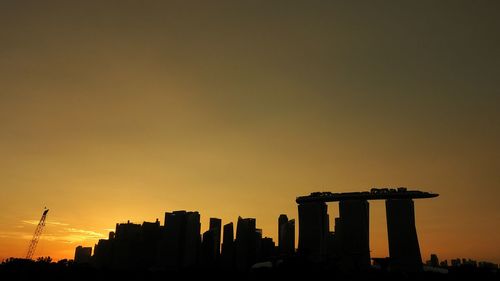 Silhouette of city during sunset