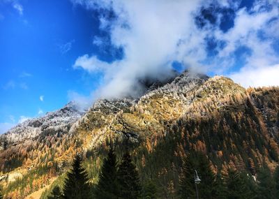 Low angle view of majestic mountains against sky