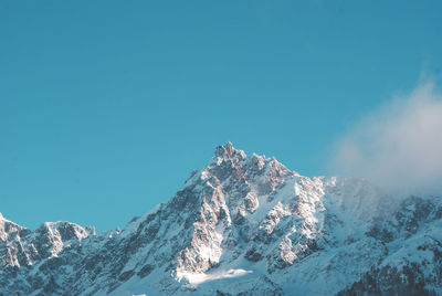 Scenic view of snow covered mountains