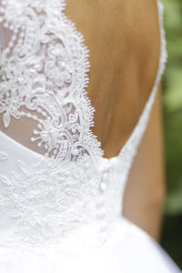 Close-up of woman wearing white dress