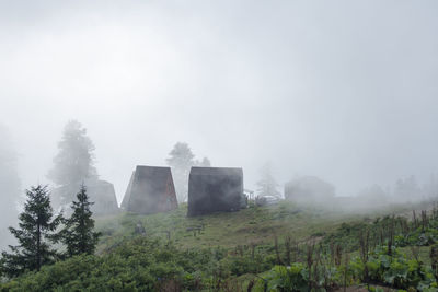 Built structure on landscape against sky