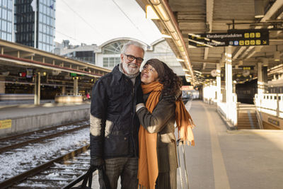 Mature couple on train station platform