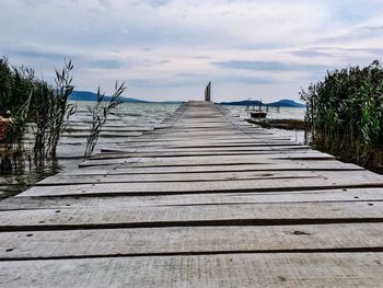 Pier over sea against sky
