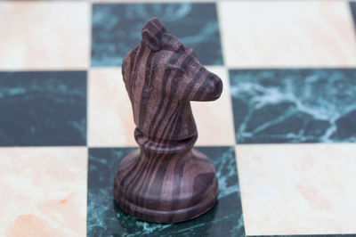 Close-up of chess pieces on table