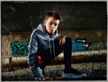 Cute boy sitting on floor