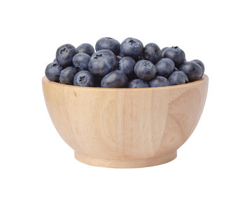 Close-up of blueberries against white background