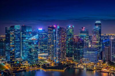 Illuminated buildings in city at night