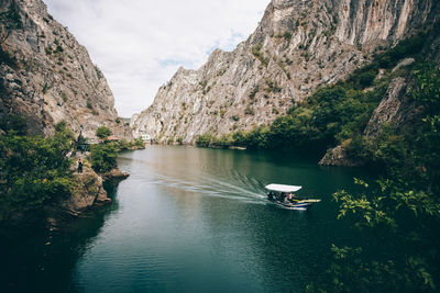 Scenic view of river amidst mountains