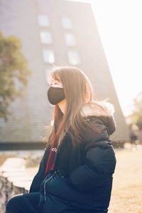 Woman looking at view of city