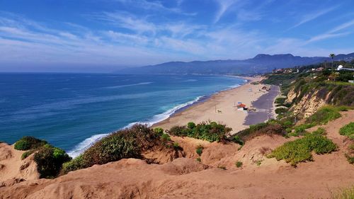 Scenic view of sea against blue sky