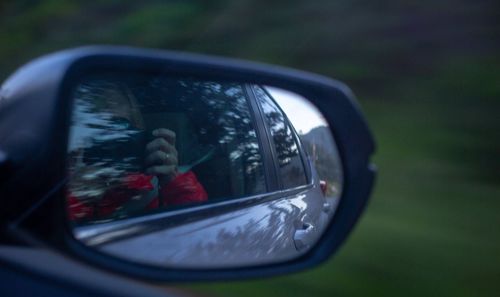 Reflection of car on side-view mirror