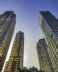 Low angle view of modern buildings against sky