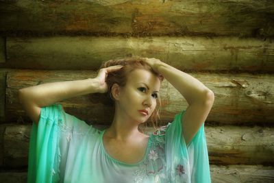 Portrait of young woman looking at camera