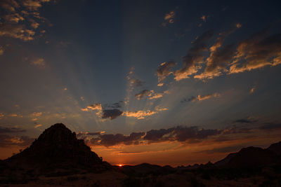 Scenic view of mountains against sky during sunset