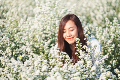 Beautiful young woman at field