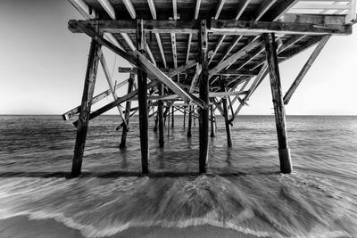 Pier on sea against sky